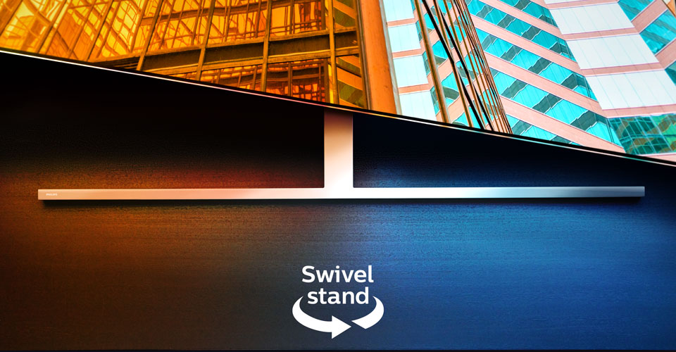 D&ouml;ner bir stand &uuml;zerinde iki renkli mimari sahneyi g&ouml;steren bir Philips Ambilight TV, d&ouml;ner &ouml;zelliği g&ouml;steren bir ok ve metin